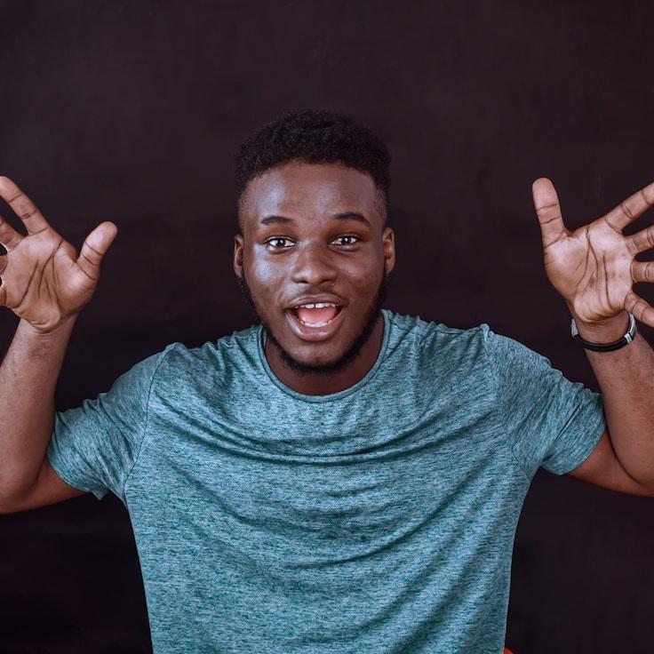 Alex Kim, Lead Design Curator at Green River Community, reviewing corporate floral arrangements
